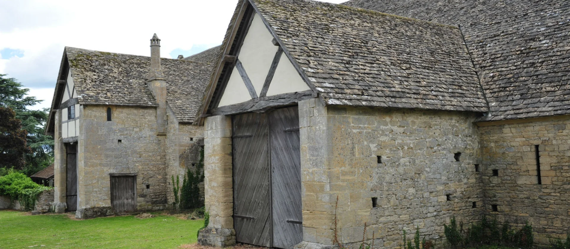 Historic barn sat in a grassy area